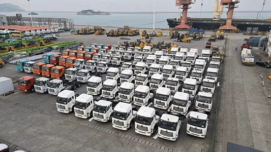 A group of kales trucks parked at the port, waiting for export.