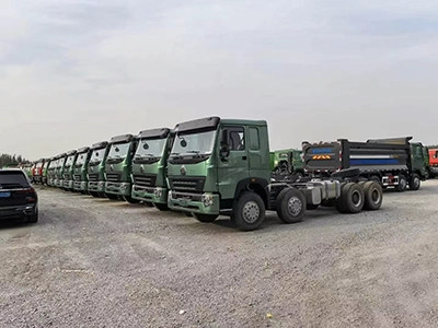 A group of kales trucks parked at the port, waiting for export.