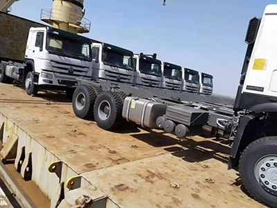 A group of kales trucks parked at the port, waiting for export.